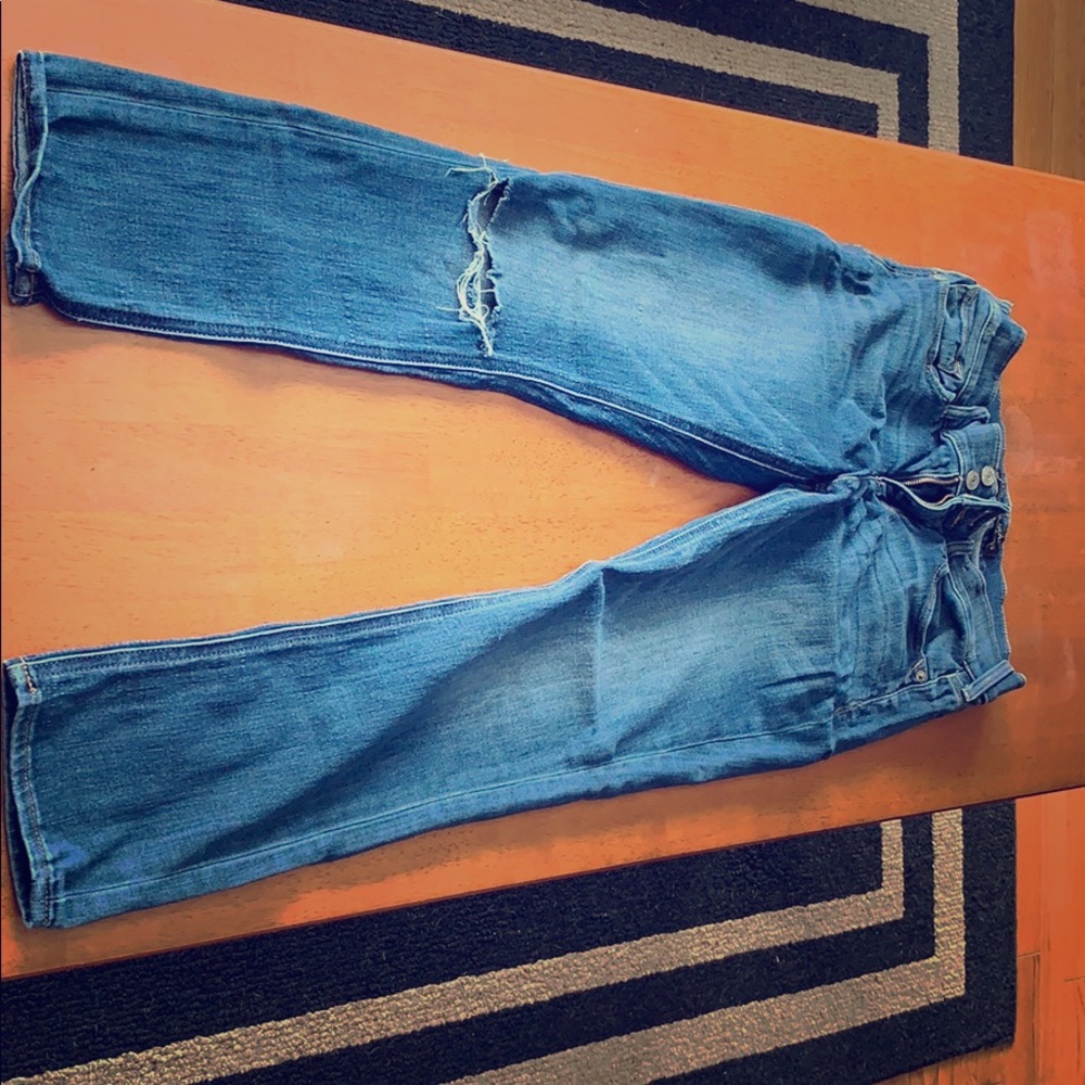 Distressed blue jeans